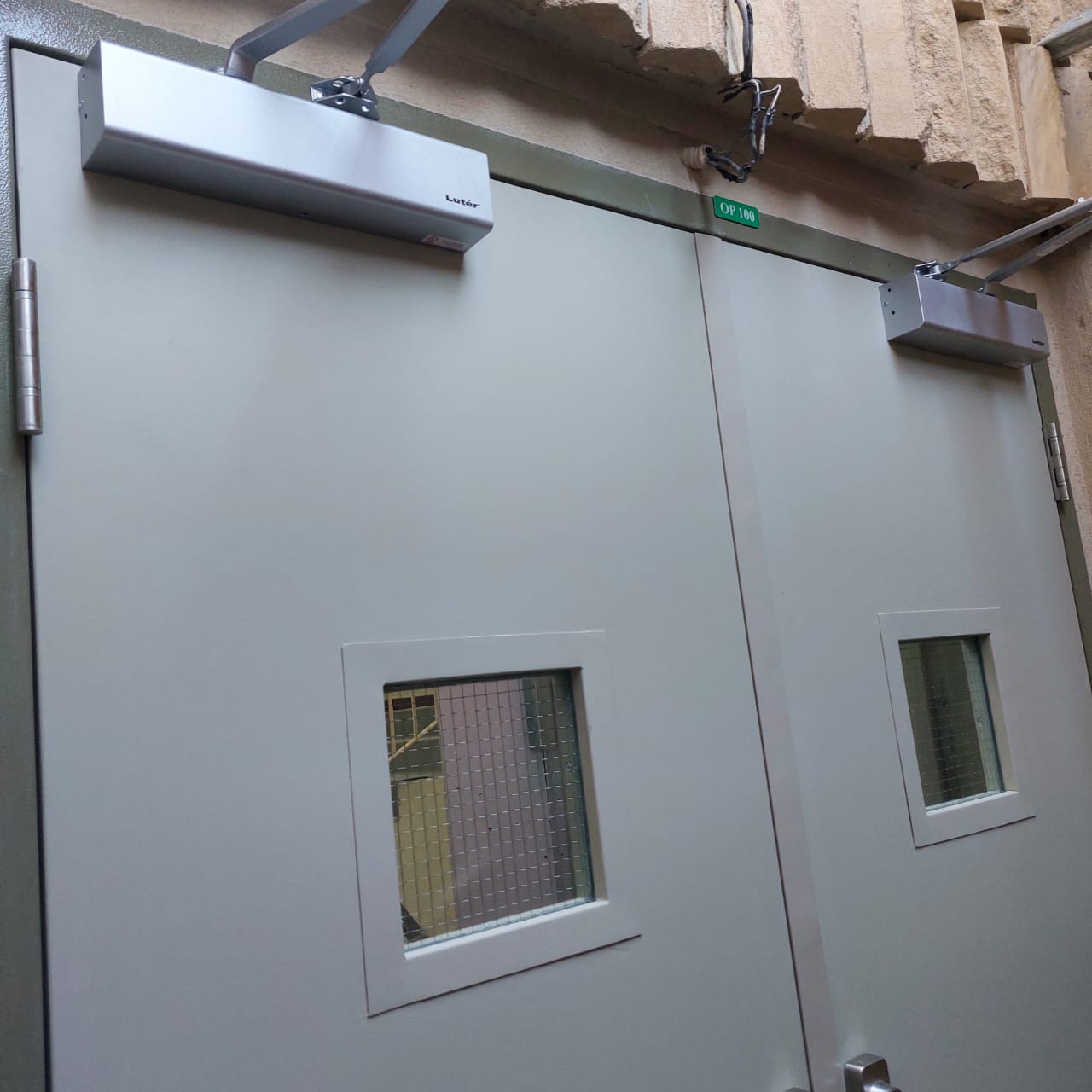 Installed fire-rated door showing electromagnetic hardware