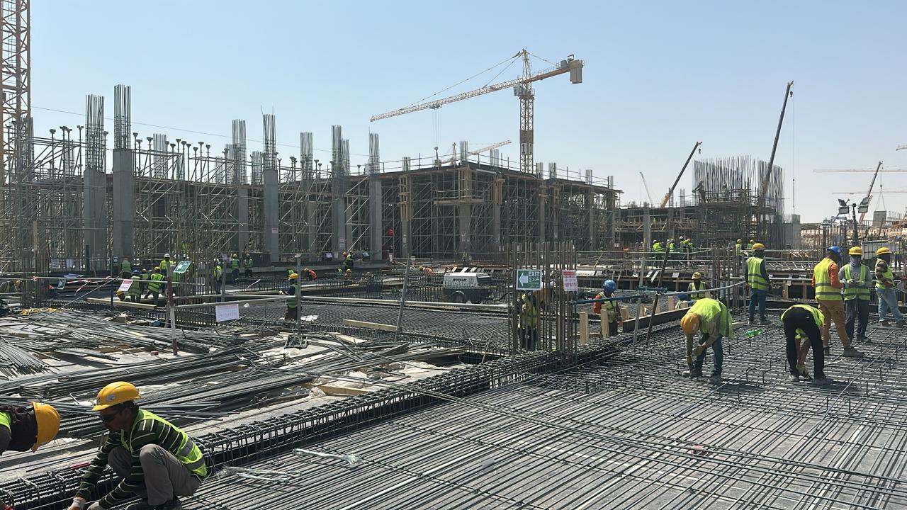 Misk City slab reinforcement activity with cranes and crews on mega-project site
